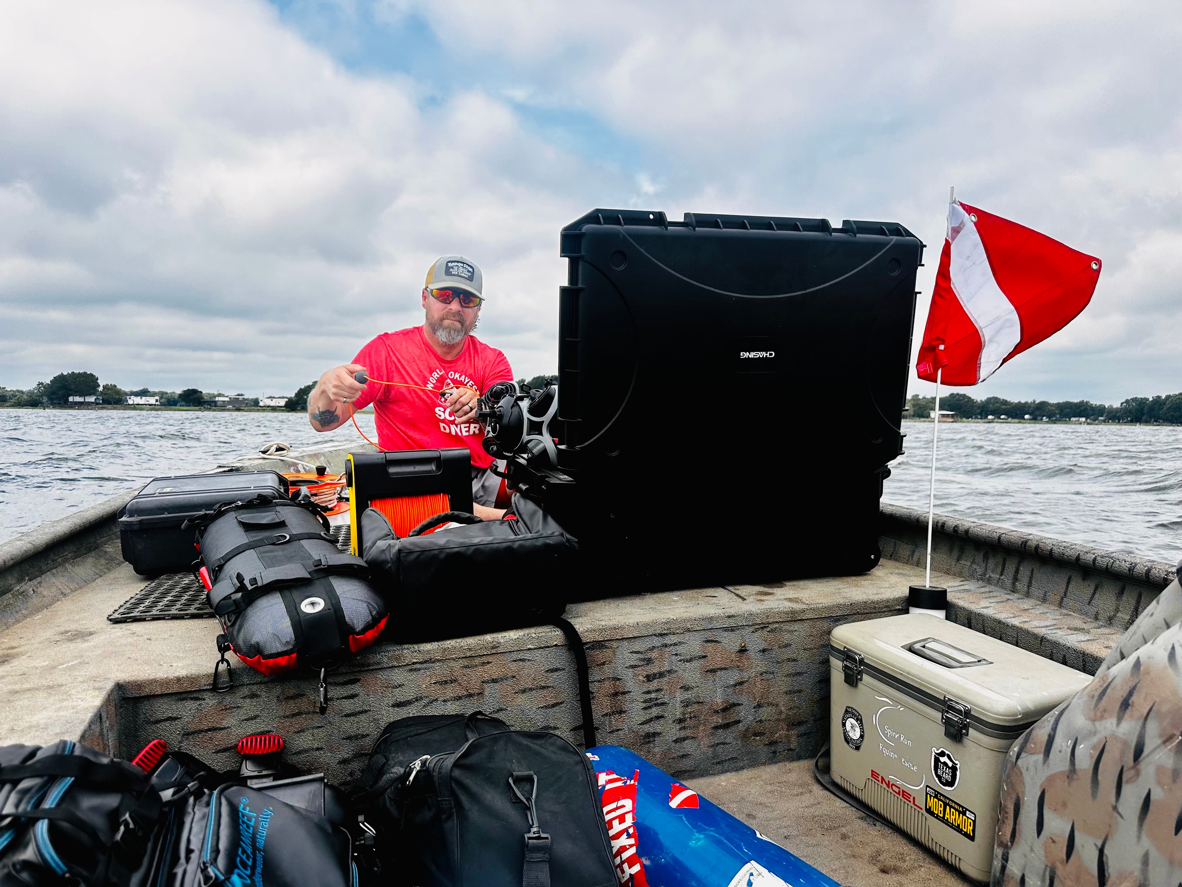 Equipment prep on the boat, dive flag up