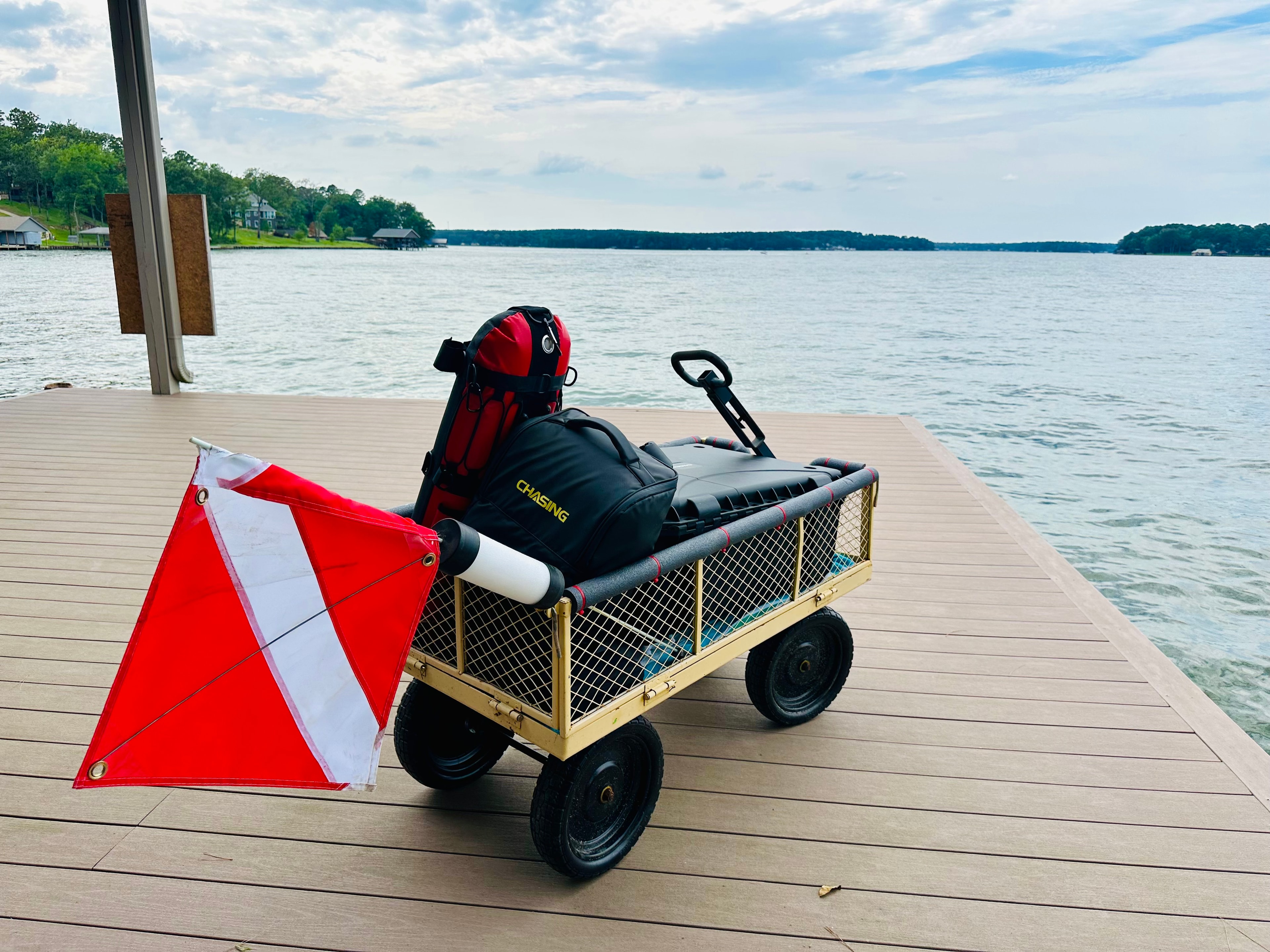 Gear cart staged with dive flag — dock deployment